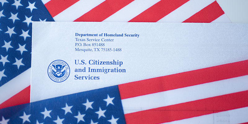 The letter head of US Citizenship and Immigration Services, a wing of Department of Homeland Security between two US flags
