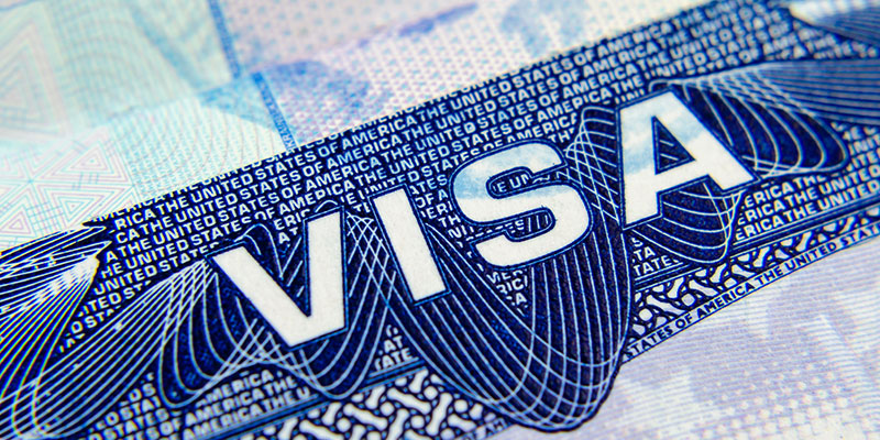 A closeup of the United States of America's H1B visa sticker on a passport