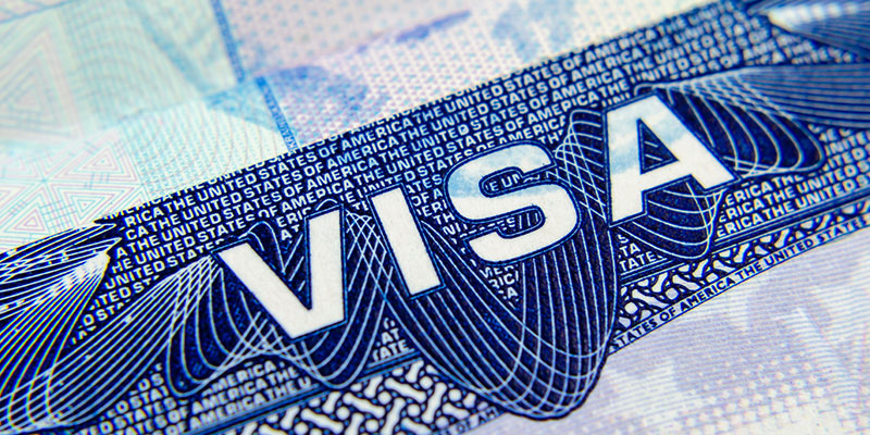 A close-up of a USA visa in a passport.